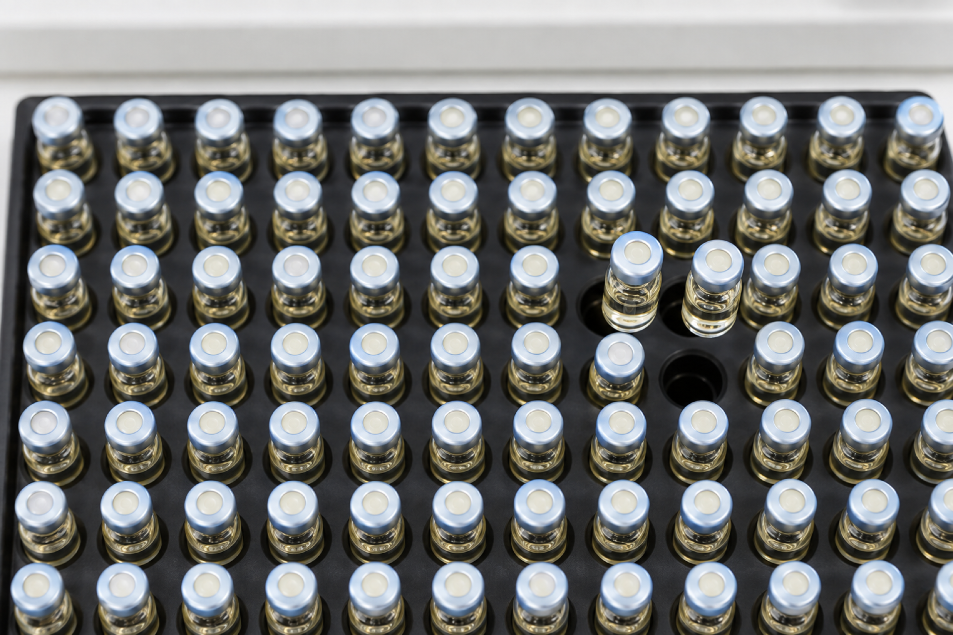 TIBD-Services-43 Sample vials lined up in a tray for testing