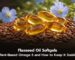 Flaxseed oil softgels on flax seeds with blue flax flowers